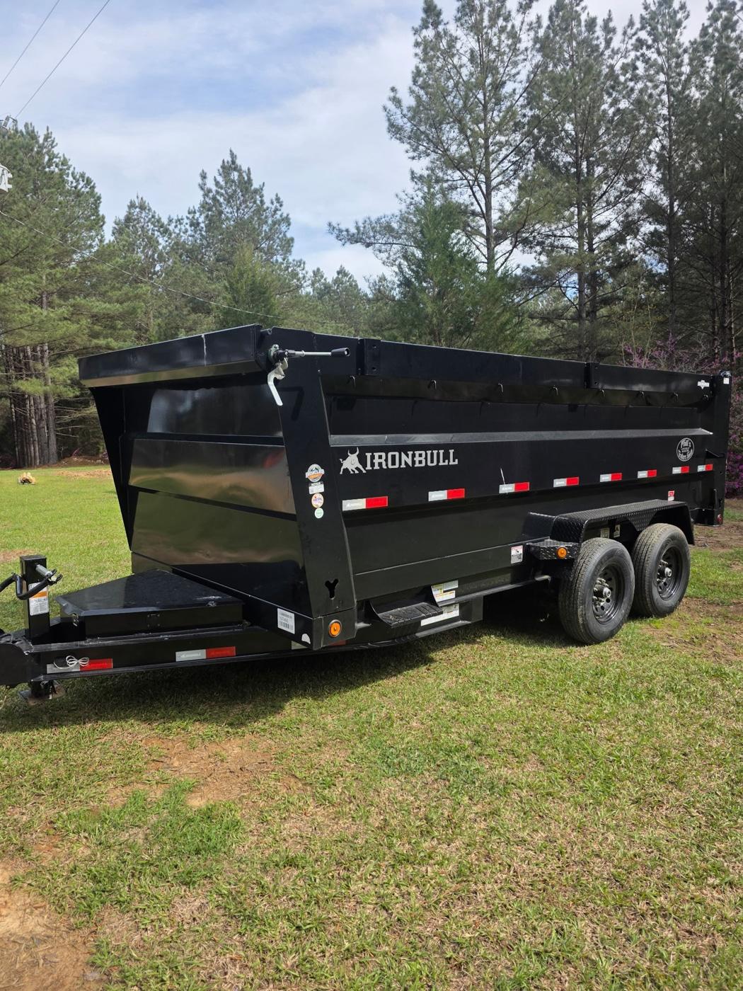 Dump trailer loaded for debris removal by PLM